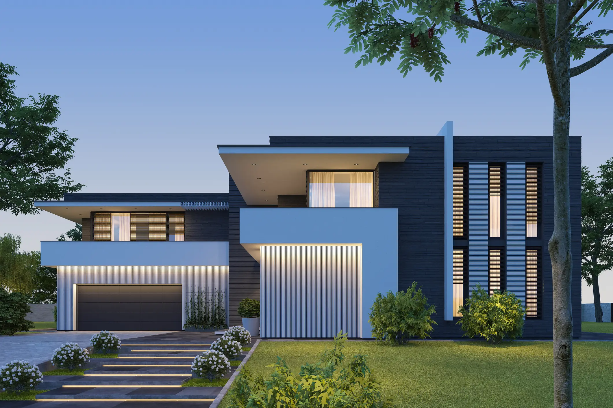 Modern house with evening lighting and trees.