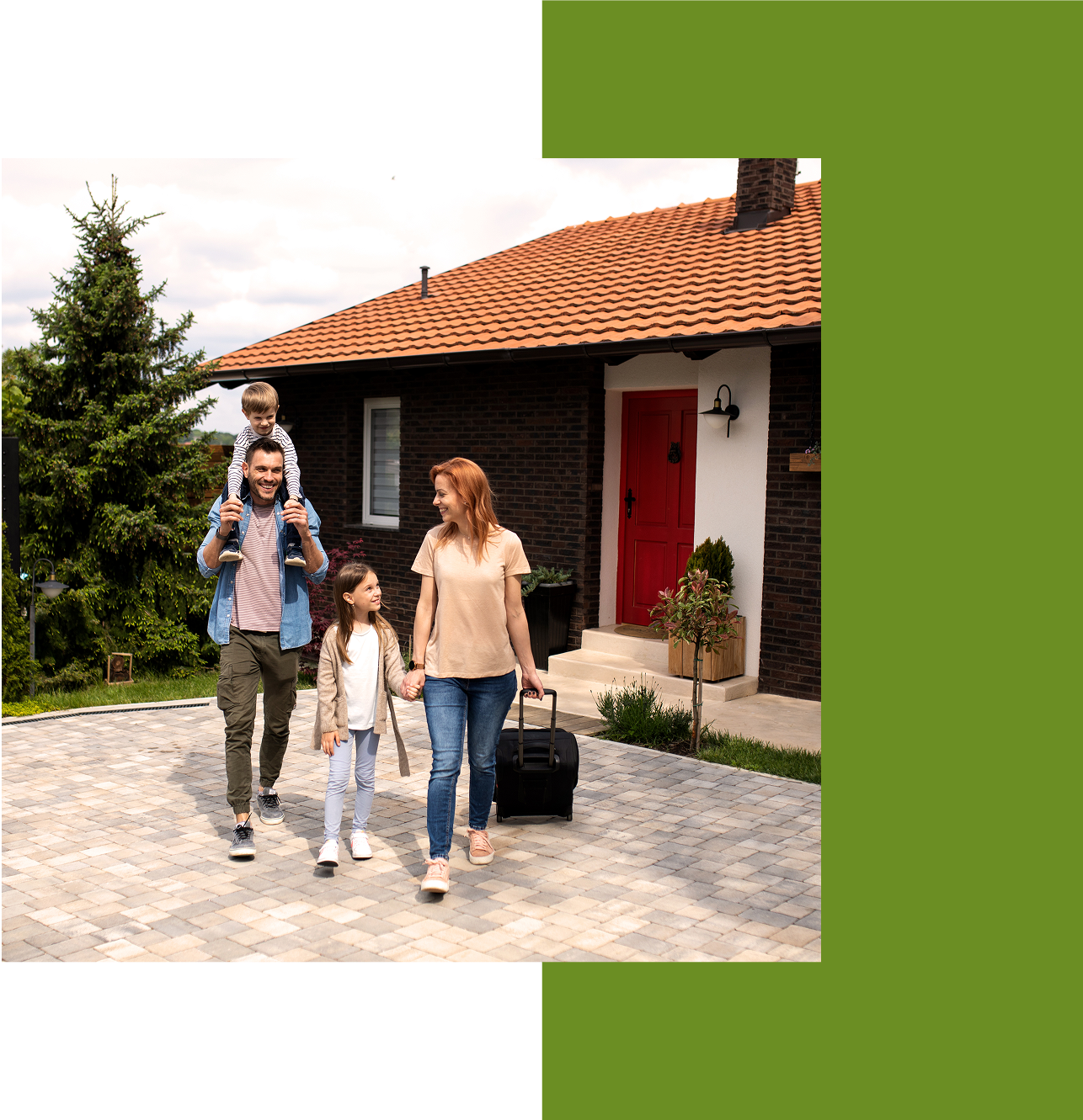 Family walking together outside a house.